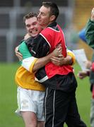 23 October 2005; Carrickmore's Manager Roger Keenan celebrates with Kevin McNally. Tyrone Senior Football Championship Final, Omagh v Carrickmore. Omagh, Co. Tyrone. Picture credit: Oliver McVeigh / SPORTSFILE