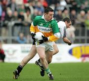 23 October 2005; Conor Gormley, Carrickmore, in action against Michael O'Neill, Omagh. Tyrone Senior Football Championship Final, Omagh v Carrickmore. Omagh, Co. Tyrone. Picture credit: Oliver McVeigh / SPORTSFILE
