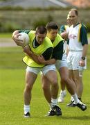 24 October 2005; Philip Jordan is tackled by Sean Cavanagh during the Ireland team training in advance of the 2nd Fosters International Rules game between Australia and Ireland, Sorrento Oval, Sorrento, Mornington Peninsula, Melbourne, Australia. Picture credit; Ray McManus / SPORTSFILE