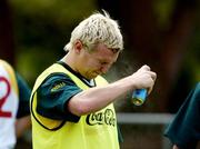 24 October 2005; Owen Mulligan applies fly repellant during the Ireland team training in advance of the 2nd Fosters International Rules game between Australia and Ireland, Sorrento Oval, Sorrento, Mornington Peninsula, Melbourne, Australia. Picture credit; Ray McManus / SPORTSFILE
