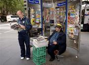 26 October 2005; Ireland's Tom Kelly reads the 'Herald Sun', in which Russell Robertson says sorry for the tackle in the first game, beside a newstand on Collins Street, Melbourne, Victoria, Australia. Picture credit; Ray McManus / SPORTSFILE