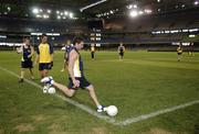 27 October 2005; Nick Davis kicks in a 'corner' during Australia's final training session in advance of the 2nd Fosters International Rules game between Australia and Ireland, Telstra Dome, Melbourne, Australia. Picture credit; Ray McManus / SPORTSFILE