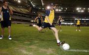 27 October 2005; Lindsay Gilbee, watched by Nick Davis, kicks in a 'corner' during Australia's final training session in advance of the 2nd Fosters International Rules game between Australia and Ireland, Telstra Dome, Melbourne, Australia. Picture credit; Ray McManus / SPORTSFILE