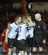 22 March 2014; Referee David McKeon awards a yellow card to Daryl Horgan depite the pleas of captain Stephen O'Donnell, Dundalk. Airtricity League Premier Division, Sligo Rovers v Dundalk, The Showgrounds, Sligo. Picture credit: Ramsey Cardy / SPORTSFILE