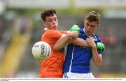 29 May 2016; Cathair McGeary of Armagh in action against Cian Madden of Cavan during the Electric Ireland Ulster GAA Football Minor Championship quarter-final between Cavan and Armagh in Kingspan Breffni Park, Cavan. Photo by Ramsey Cardy/Sportsfile
