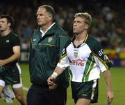 28 October 2005; Anthony Lynch, Ireland, and Dr. Con Murphy leave the field at half time. Australia. 2005 Fosters International Rules Series, game 2, Australia v Ireland, Telstra Dome, Melbourne, Australia. Picture credit; Ray McManus / SPORTSFILE