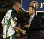 28 October 2005; GAA President presents the best Irish player of the game award to Tom Kelly. 2005 Fosters International Rules Series, game 2, Australia v Ireland, Telstra Dome, Melbourne, Australia. Picture credit; Ray McManus / SPORTSFILE
