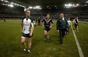 28 October 2005; Benny Coulter, Brian Dooher and Dr Con Murphy leave the field. 2005 Fosters International Rules Series, game 2, Australia v Ireland, Telstra Dome, Melbourne, Australia. Picture credit; Ray McManus / SPORTSFILE