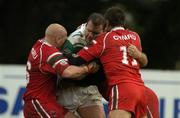 29 October 2005; Paul McNicholas, Ireland, is tackled by Byron Smith, left, and Chris Morley, Wales. Rugby League International European Nations Cup, Ireland v Wales, Lakelands Park, Terenure, Dublin. Picture credit: Brendan Moran / SPORTSFILE