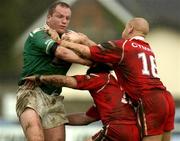 29 October 2005; Terry O'Connor, Ireland, is tackled by Jordan James and Byron Smith (16), Wales. Rugby League International European Nations Cup, Ireland v Wales, Lakelands Park, Terenure, Dublin. Picture credit: Brendan Moran / SPORTSFILE