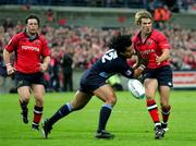 29 October 2005; Gary Connolly with Marcus Horan, left, Munster, is tackled by  Freddie Tuilagi, Castres Olympique. Heineken Cup 2005-2006, Pool 1, Munster v Castres Olympique, Thomond Park, Limerick. Picture credit; Kieran Clancy / SPORTSFILE