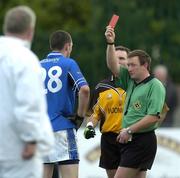 30 October 2005; Referee Pat Fox shows the red card to Ulster's Enda McNulty and Munster's Kieran Donaghty. M Donnelly Interprovincial Football Championship Semi-Final, Ulster v Munster, St. Oliver Plunkett Park, Crossmaglen, Co. Armagh. Picture credit: Damien Eagers / SPORTSFILE