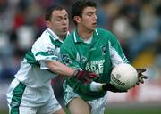 30 October 2005; Colm Kelly, Stradbally, in action against Michael Fennelly, Portlaoise. Laois County Senior Football Championship Final, Portlaoise v Stradbally, O'Moore Park, Portlaoise, Co. Laois. Picture credit: David Maher / SPORTSFILE