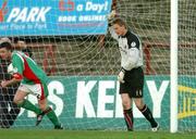 31 October 2005; A dejected Bohemians goalkeeper Matt Gregg, holds the net after his mistake lead to Cork City's first goal with Roy O'Donovan, far right, Cork City. eircom League, Premier Division, Bohemians v Cork City, Dalymount Park, Dublin. Picture credit: David Maher / SPORTSFILE