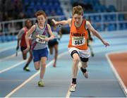 29 March 2014; Shane Fitzgerald, St. Mary's A.C., crosses the finish line to win the U12 Boy's 4x100m Final at the Woodie’s DIY Juvenile Indoor Track and Field Championships. Athlone Institute of Technology International Arena, Athlone, Co. Westmeath. Picture credit: Pat Murphy / SPORTSFILE