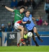 29 March 2014; Ger Cafferkey, Mayo, clears the ball under pressure from Cormac Costello, Dublin. Allianz Football League, Division 1, Round 6, Dublin v Mayo. Croke Park, Dublin. Picture credit: Ray McManus / SPORTSFILE