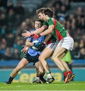 29 March 2014; Cormac Costello, Dublin, is tackled by Ger Cafferkey, right, and Aidan O'Shea, Mayo. Allianz Football League, Division 1, Round 6, Dublin v Mayo. Croke Park, Dublin. Picture credit: Ray McManus / SPORTSFILE