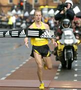 31 October 2005; Dmytro Osadchy of the Ukraine crosses the line to win the Men's race at the 2005 adidas Dublin City Marathon. Picture credit: Brendan Moran / SPORTSFILE