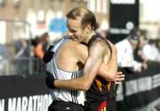 31 October 2005; Pauric McKinney, right, congratulates Gary Crossan after they finished 2nd and 1st Irish men home respectively, which also doubled as the National Marathon Championship, during the 2005 adidas Dublin City Marathon. Picture credit: Brendan Moran / SPORTSFILE