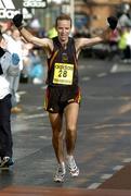 31 October 2005; Pauric McKinney celebrates as he comes home to finish 2nd Irishman and 14th overall during the 2005 adidas Dublin City Marathon. Picture credit: Brendan Moran / SPORTSFILE