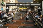 31 October 2005; Zinaida Samenova of Russia crosses the line to win the Women's race at the 2005 adidas Dublin City Marathon. Picture credit: Pat Murphy / SPORTSFILE
