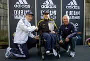 31 October 2005; Men's Wheelchair race winner John Glynn is presented with his trophy by Race Director Jim Aughney, left, and Robin Money, Head of Sports Marketing, adidas Area North, during the 2005 adidas Dublin City Marathon. Picture credit: Brendan Moran / SPORTSFILE