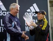 31 October 2005; Women's race winner Zinaida Semenova of Russia is presented with her trophy by Robin Money, Head of Sports Marketing, adidas Area North, during the 2005 adidas Dublin City Marathon. Picture credit: Brendan Moran / SPORTSFILE