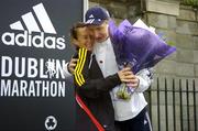 31 October 2005; First Irish woman home Pauline Curley is congratulated by Race Director Jim Aughney after the 2005 adidas Dublin City Marathon. Picture credit: Brendan Moran / SPORTSFILE
