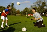 2 November 2005; Former Republic of Ireland International Niall Quinn practices his headding with Dale Kinsella from Dublin's Docklands during the premier Docklands Soccer Camp and Mini World Cup Tournament. ALSAA Sports Complex, Dublin. Picture credit: Pat Murphy / SPORTSFILE