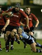 4 November 2005; Trevor Hogan, Munster, is tackled by Ryan Powell, Cardiff Blues. Celtic League 2005-2006, Group A, Cardiff Blues v Munster, Arms Park, Cardiff, Wales. Picture credit: Brendan Moran / SPORTSFILE