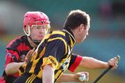 6 November 2005; Frankie Carroll, Garryspillane, in action against Willie Kiely, Ballygunner. Munster Club Senior Hurling Championship, Garryspillane v Ballygunner, Thomond Park, Limerick. Picture credit: Kieran Clancy / SPORTSFILE