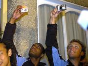 9 November 2005; Joe Rockocoko, left, and Angus McDonald, members of the New Zealand All Blacks team, take pictures during a visit to the birthplace of Dave Gallaher as part of centenary celebrations for the Originals tour. Players and New Zealand Rugby Union officials travelled to the village of Ramelton in County Donegal where the Originals' captain was born. Ramelton, Co. Donegal. Picture credit: Pat Murphy / SPORTSFILE