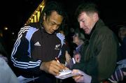9 November 2005; New Zealand All Blacks team captain Tana Umaga signs autographs for fans in Ramelton, Co. Donegal, during a visit to the birthplace of Dave Gallaher as part of centenary celebrations for the Originals tour. Players and New Zealand Rugby Union officials travelled to the village of Ramelton in County Donegal where the Originals' captain was born. Ramelton, Co. Donegal. Picture credit: Pat Murphy / SPORTSFILE