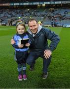 29 March 2014; Match day mascot Éabha Ní Mhaoldúin, four years, and a member of the Round Tower GAA Club / Gaelscoil Chluain Dolcáin, with Dublin manager Jim Gavin, himself a Round Tower member, before the game. Allianz Football League, Division 1, Round 6, Dublin v Mayo. Croke Park, Dublin. Picture credit: Ray McManus / SPORTSFILE