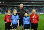 29 March 2014; Referee Cormac Reilly with match day mascots Alan Barry and Sean Boyne and Young Whistlers Dara O'Grady and Holly-Jo Clarke before the game. Allianz Football League, Division 1, Round 6, Dublin v Mayo. Croke Park, Dublin. Picture credit: Ray McManus / SPORTSFILE