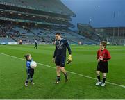 29 March 2014; Match day mascot Éabha Ní Mhaoldúin, four years, and a member of the Round Tower GAA Club / Gaelscoil Chluain Dolcáin, and 'Young Whistler' Dara O'Grady, St Bridgets School, Killester, with Dublin captain Stephen Cluxton before the game. Allianz Football League, Division 1, Round 6, Dublin v Mayo. Croke Park, Dublin. Picture credit: Ray McManus / SPORTSFILE