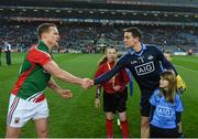 29 March 2014; Match day mascots look on as Dublin captain Stephen Cluxton and Mayo captain Andy Moran shake hands before the game. Allianz Football League, Division 1, Round 6, Dublin v Mayo. Croke Park, Dublin. Picture credit: Ray McManus / SPORTSFILE