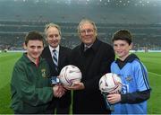 29 March 2014; Donal Bollard, from Allianz, and Edward O' Riordan, Cumann na mBunscoil Chairman, make special presentations to Seosamh Ó Muirí, left, Round Tower, and Cian O Cathasaigh, Kilmacud Crokes, for their outstanding performance during the Allianz Cumann na mBunscol competitions. Allianz Football League Division 1 Round 6, Dublin v Mayo, Croke Park, Dublin. Picture credit: Ray McManus / SPORTSFILE