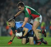 29 March 2014; Eoghan O'Gara, Dublin, is tackled by Mayo's Shane McHale. Allianz Football League, Division 1, Round 6, Dublin v Mayo. Croke Park, Dublin. Picture credit: Ray McManus / SPORTSFILE