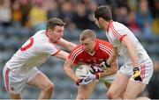 30 March 2014; Brian Hurley, Cork, in action against Ciaran McGinley, left, and Aidan McCrory, Tyrone. Allianz Football League Division 1, Round 6, Cork v Tyrone, Pairc Ui Rinn, Cork. Picture credit: Ramsey Cardy / SPORTSFILE