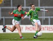 30 March 2014; Amy Foley, Kerry, shoots to score her side's fourth goal despite the efforts of Mary Naughton, Mayo. TESCO Homegrown Ladies National Football League, Division 1, Round 6, Kerry v Mayo, Fitzgerald Stadium, Killarney, Co. Kerry. Picture credit: Barry Cregg / SPORTSFILE