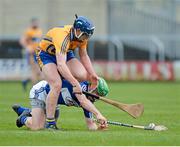30 March 2014; Conor Cooney, Clare, in action against Tommy Fitzgerald, Laois. Allianz Hurling League Division 1, Quarter-Final, Laois v Clare, O'Moore Park, Portlaoise, Co. Laois. Picture credit: Ray McManus / SPORTSFILE