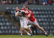 30 March 2014; Ronan McNamee, Tyrone, in action against James Loughrey, supported by Andrew O'Sullivan, Cork. Allianz Football League Division 1, Round 6, Cork v Tyrone, Pairc Ui Rinn, Cork. Picture credit: Ramsey Cardy / SPORTSFILE