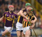 30 March 2014; Eoin Larkin, Kilkenny, is tackled by Matthew O'Hanlon, Wexford. Allianz Hurling League Division 1, Quarter-Final, Wexford v Kilkenny, Wexford Park, Wexford. Picture credit: Brendan Moran / SPORTSFILE