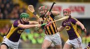 30 March 2014; Eoin Larkin, Kilkenny, in action against Matthew O'Hanlon, left, and Lee Chin, Wexford. Allianz Hurling League Division 1, Quarter-Final, Wexford v Kilkenny, Wexford Park, Wexford. Picture credit: Brendan Moran / SPORTSFILE
