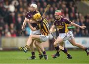 30 March 2014; Colin Fennelly, Kilkenny, is shouldered by Ciarán Kenny, Wexford. Allianz Hurling League Division 1, Quarter-Final, Wexford v Kilkenny, Wexford Park, Wexford. Picture credit: Brendan Moran / SPORTSFILE