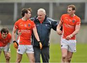 30 March 2014; Armagh manager Paul Grimley pulls Tony Kernan, left, and Kieran Toner away from an altercation with Galway players. Allianz Football League Division 2, Round 6, Galway v Armagh, Tuam Stadium, Tuam, Co. Galway. Picture credit: Ray Ryan / SPORTSFILE