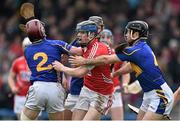 30 March 2014; Conor Lehane, Cork, is tackled by Tipperary players, from left, Paddy Stapleton, Thomas Stapleton and Conor O'Brien. Allianz Hurling League Division 1, Quarter-Final, Tipperary v Cork, Semple Stadium, Thurles, Tipperary. Picture credit: David Maher / SPORTSFILE