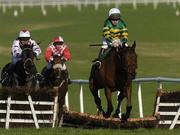 12 November 2005; Forty Licks with Conor O'Dwyer up, jumps the last from Travino with David Casey up, centre, and Woodhouse with Adrian Leigh up, on their way to winning the INH Stallion Owners EBF Maiden Hurdle. Naas Racecourse, Naas, Co. Kildare. Picture credit: Damien Eagers / SPORTSFILE