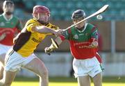 13 November 2005; Eoin McCormack, James Stephens, is tackled by Damien Roberts, Naomh Eoin. Leinster Club Senior Hurling Championship, Naomh Eoin v James Stephens, Dr. Cullen Park, Co. Carlow. Picture credit: Matt Browne / SPORTSFILE